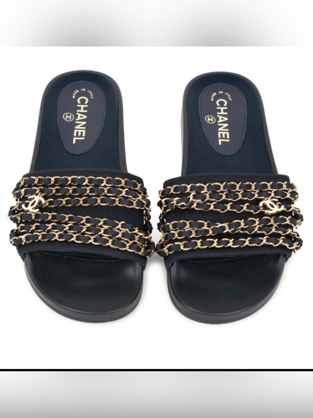 CHANEL navy slides gold chain and CC charms.
